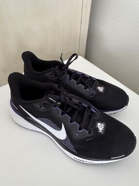 Nike Men's Black and White Running Shoes with Purple Accents